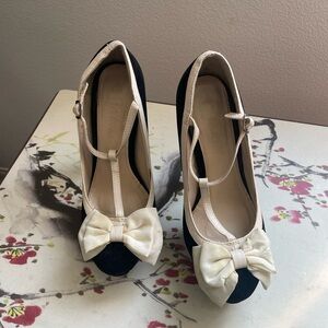 Modesta Black and White High Heeled T-Strap Pumps